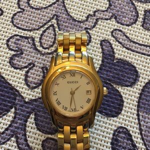 Gucci women’s gold date watch